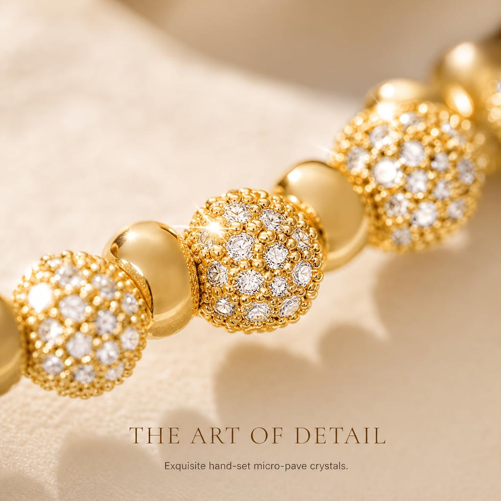 \nBall-shaped lucky charm made of synthetic zirconium plated with gold18K Gold bracelet A versatile gold-plated bracelet with a touch of luxury charm