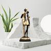 Stylish Golden Black Resin Romantic Couple Statue for Home Decor (Pack of 1, Black & Golden)