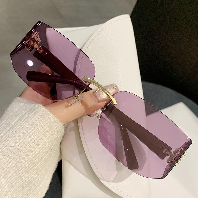 Zhang Yuanying's new frameless curved sunglasses women's yk light luxury fashion brown high-end sunglasses