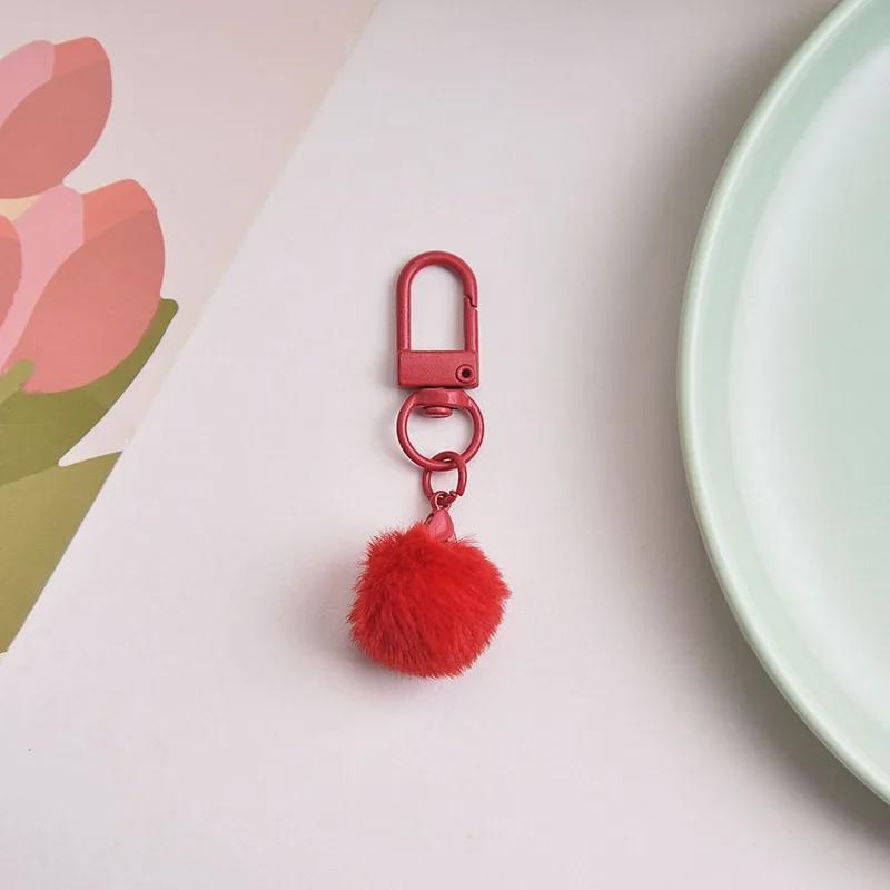 Брелок для ключей в виде разноцветного плюшевого шарика с молочным кулоном, абажуром в виде макарон и вращающейся пряжкой.