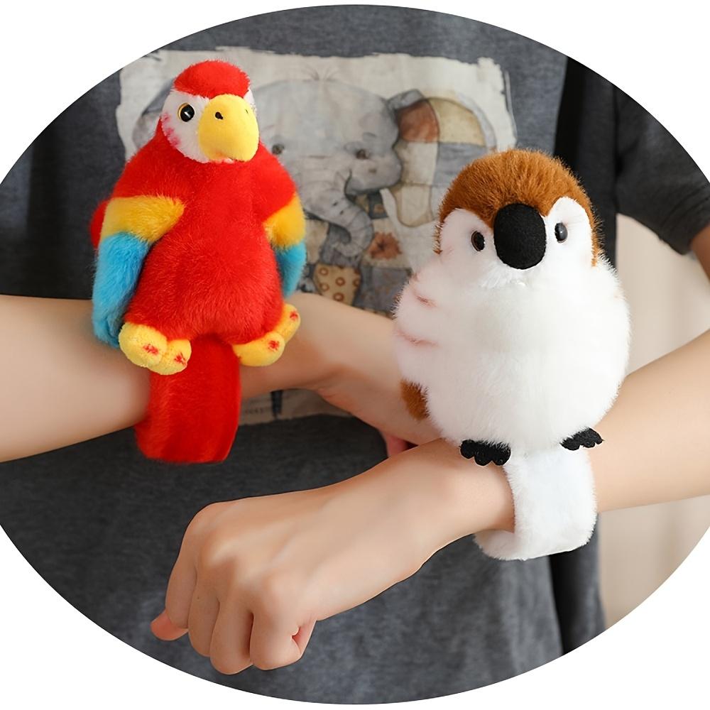 Cute parrot plush wristband with snap closure. Colorful bird-shaped wearable toy for kids, lovely collectible accessory.
