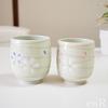 Hasami Ware Teacup Pair Set with Cherry Blossom Spiral Design.