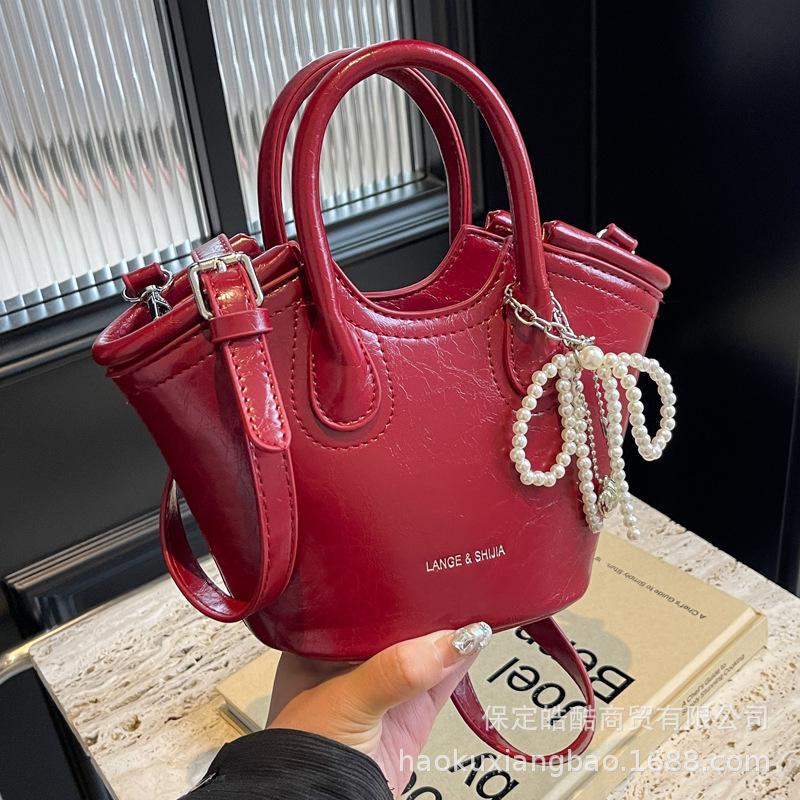 Сумка женская 2025 новая сумка-мессенджер модный нишевый дизайн летняя портативная сумка-ведро рабочая маленькая сумка