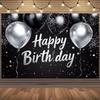 A Birthday Celebration Theme Backdrop, Featuring Silver and Black Balloons, Shiny Stars and Festive Decorations