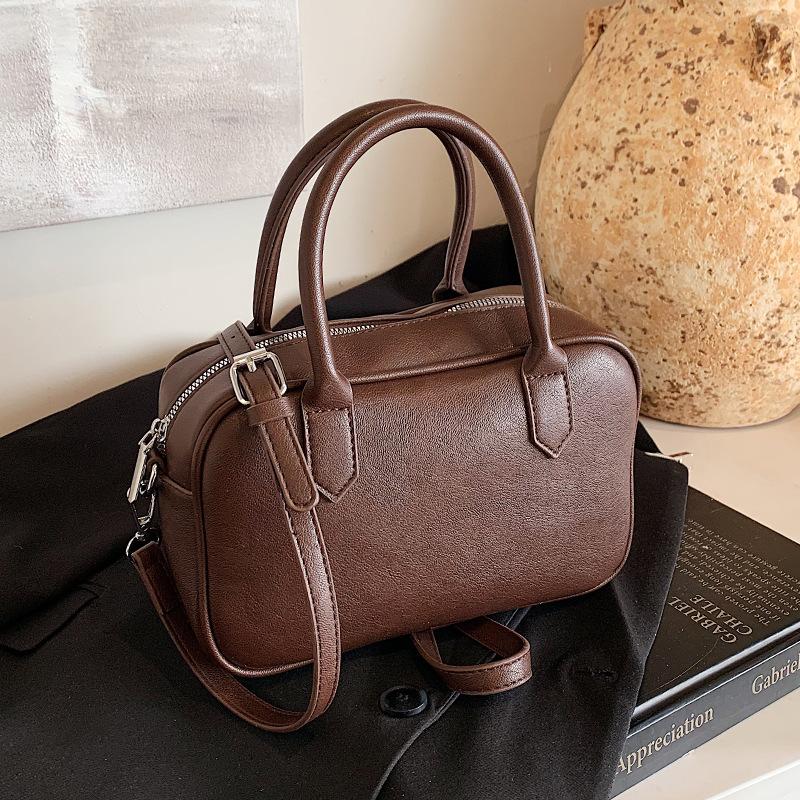 Popular fashion simple texture solid color portable Boston bag women's retro niche casual shoulder messenger bag