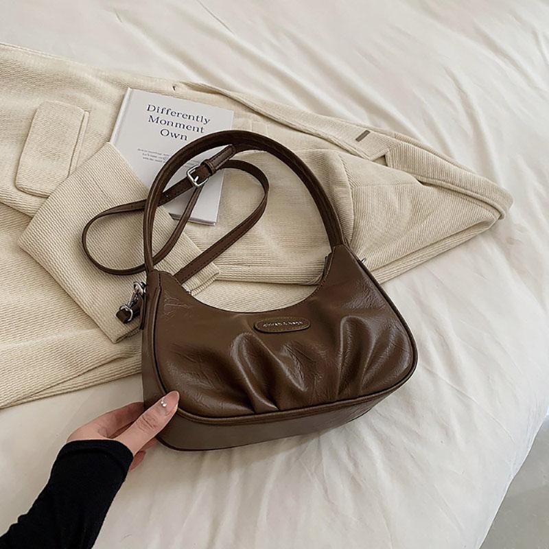 Корейская версия подмышечная сумка складная искусственная кожа однотонная женская сумка нишевый дизайн чувственная текстура одно плечо сумка простая новая