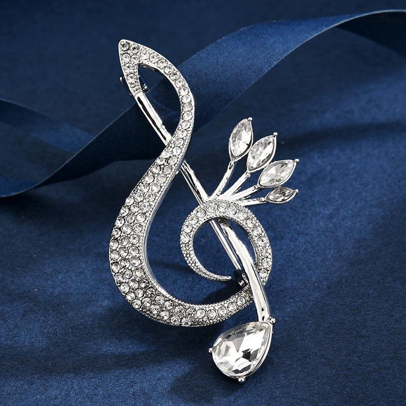 Exquisite Silver Music Note Brooch for Women - Fashionable Lapel Pin for Coats and Suits, Luxurious Accessory