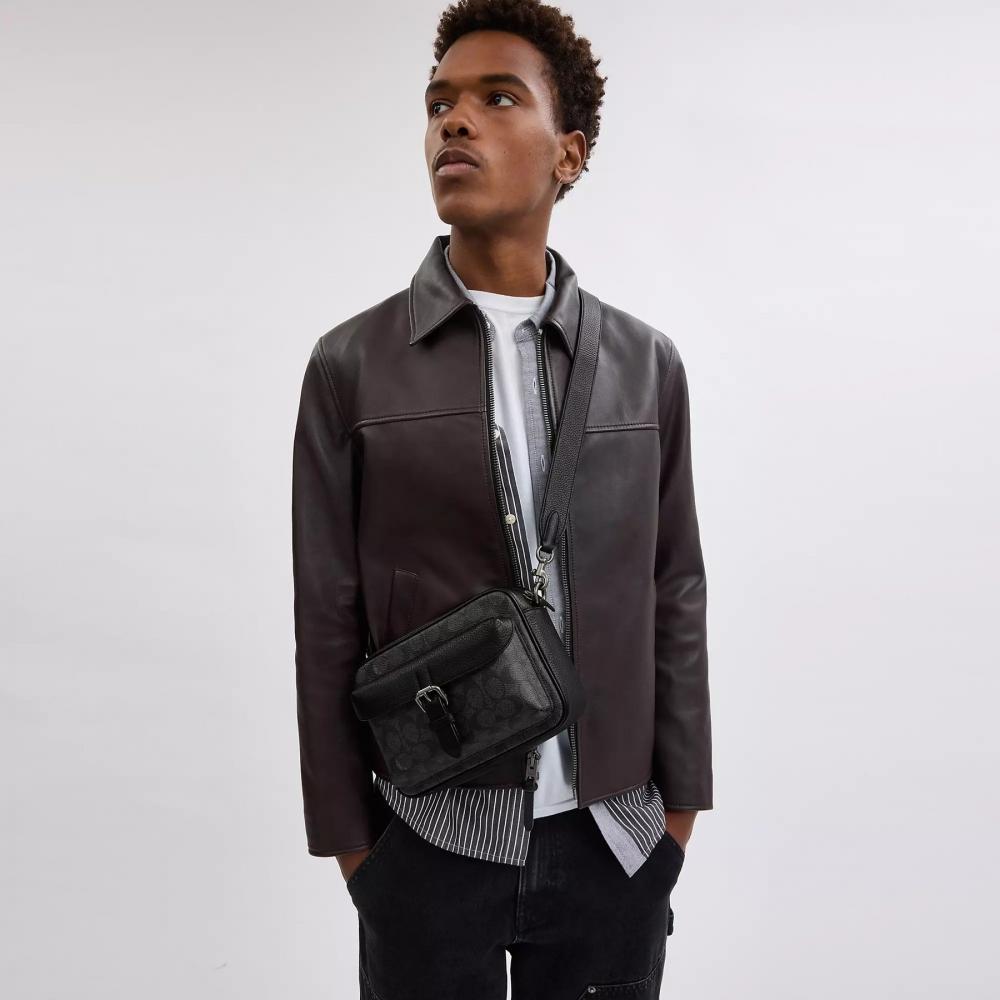 Coach Сумка через плечо Warner из фирменного холста цвета оружейного металла, угольно-черного цвета