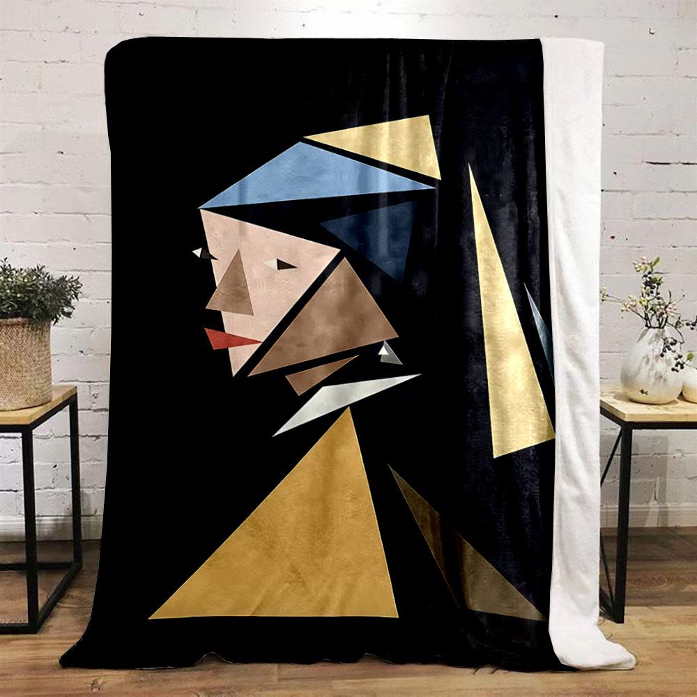 Geometric triangular shapes form an abstract portrait against a dark background. for all seasons blanket lunch break throw gift