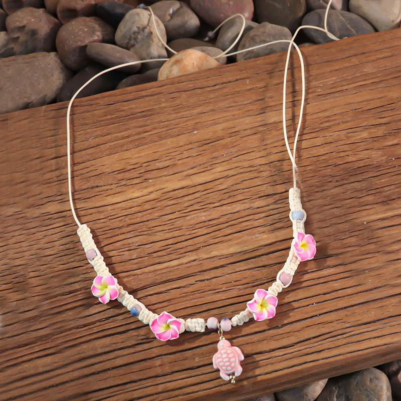 Bohemian vacation style egg flower necklace earrings set ins niche flower soft pottery color collarbone chain tide