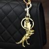 Colorful Dinosaur Skeleton Pendant Keychain Unique Metal Key Chain Bag Decoration for Trendy Individuals and Students