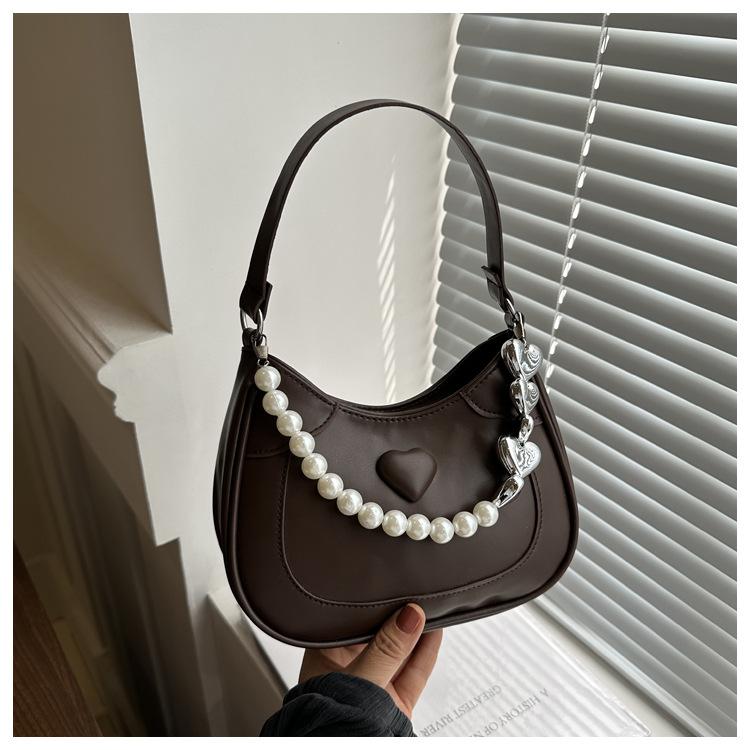 Жемчужная сумочка женская 2024 новая трендовая корейская нишевая сумка подмышку премиальная иностранная сумка-мессенджер сумка на плечо
