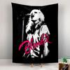 A white silhouette of a woman singing with pink "Blondie" text below. Patterned tapestry for bedroom and living room home decor
