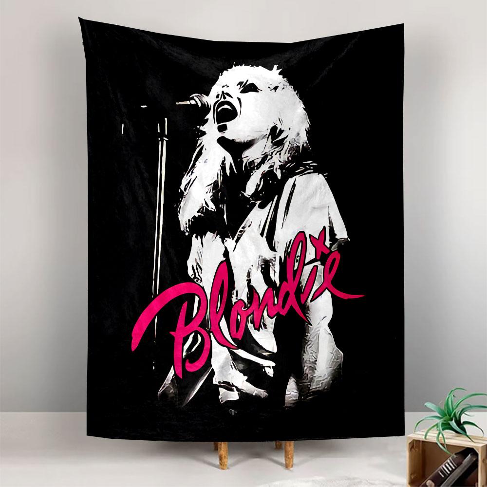 A white silhouette of a woman singing with pink "Blondie" text below. Patterned tapestry for bedroom and living room home decor