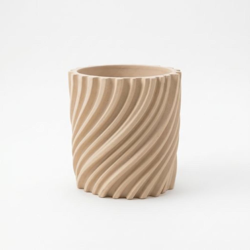 Modern wavy beige flowerpot for plants, twisted shape