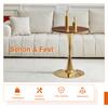 Round 60 cm MDF table, walnut wood look, gold-colored support foot, with 2 white dining chairs, diamond pattern, gold-colored metal frame.