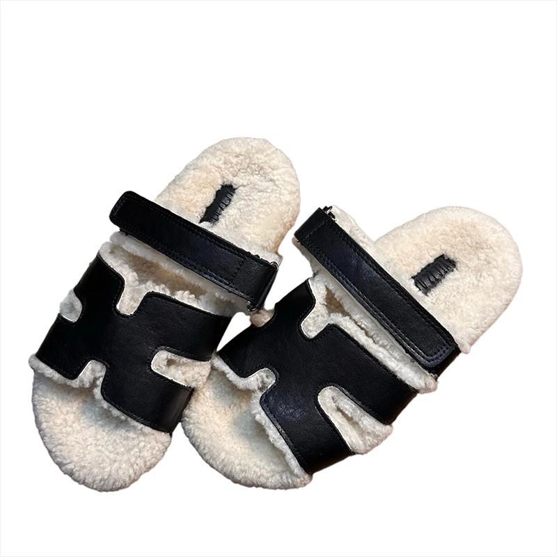 Европейские товары 2025 осень и зима новые кожаные на толстой подошве тапочки из овечьей шерсти женские носят знаменитости интернета на плоской подошве ленивые шерстяные тапочки