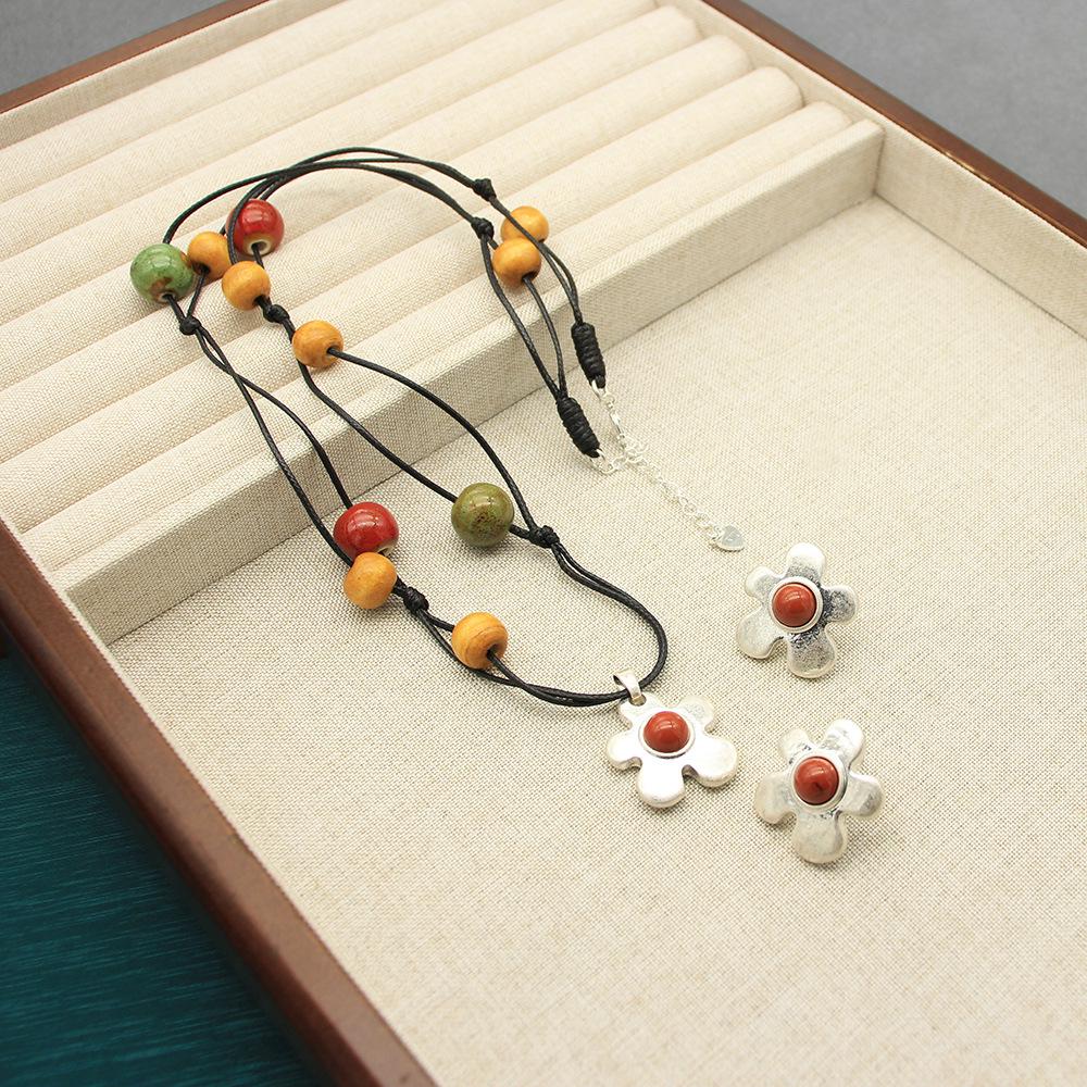 Керамическое ожерелье с фруктами и карибским цветком и серьги с красным камнем