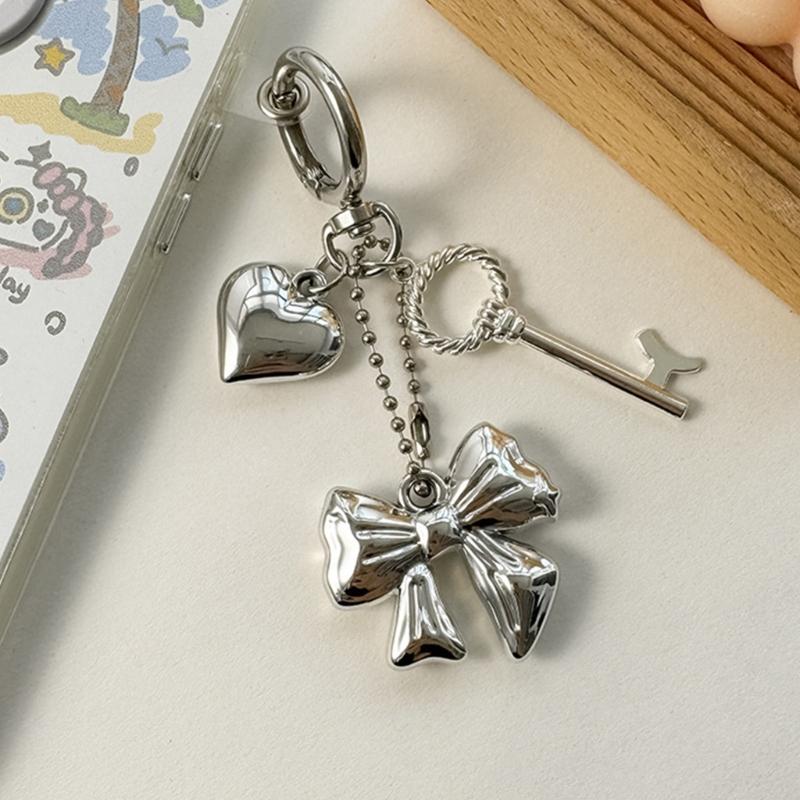 Elegant Heart Phone Bag Accessory Fashionable Silver Bowknot Keychain with Heart Charm Unique Keyrings Accessory