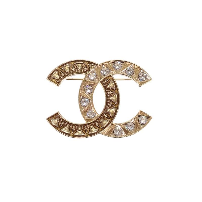 Chanel Брошь золотистый металл Женщины