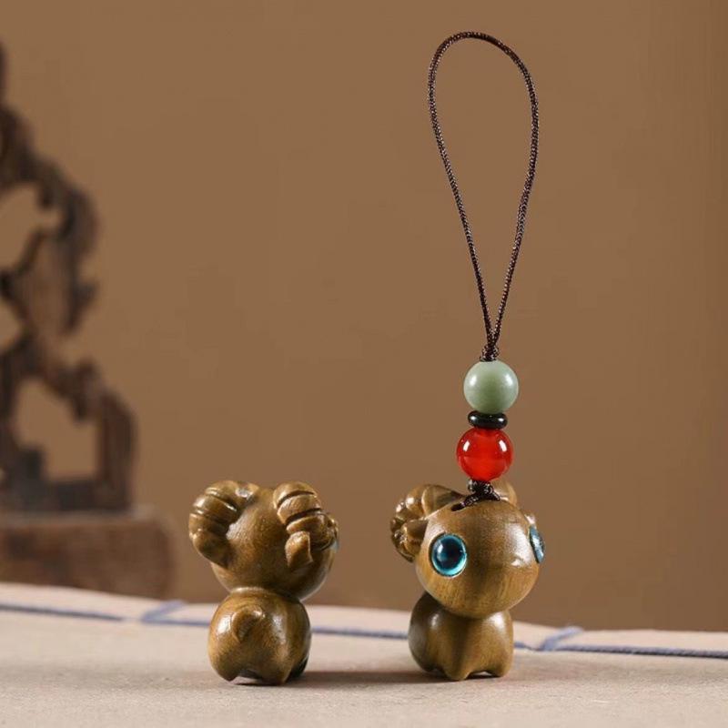Twelve Zodiac Animal Charms Green Sandalwood Set: Rat, Ox, Tiger, Rabbit, Dragon, Snake, Horse, Sheep, Monkey, Rooster, Dog, Pig.