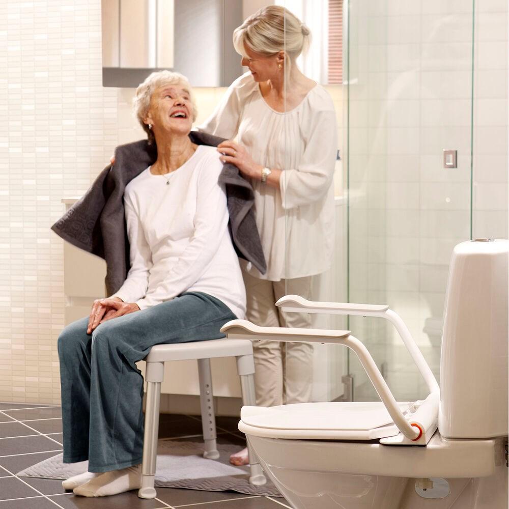 Etac Supporter - toilet seat cover with lid and armrests up to 150