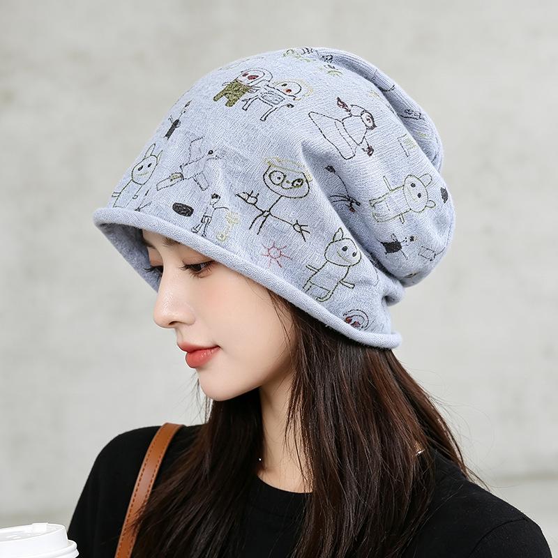 Source cartoon graffiti printing stack hat female autumn and winter warm literary cold hat casual bag head hat