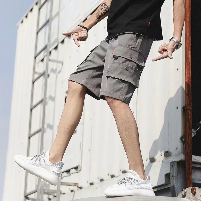 Мужские шорты, летние свободные повседневные брюки, трендовые универсальные комбинезоны, пляжные брюки, мужские пятиточечные брюки