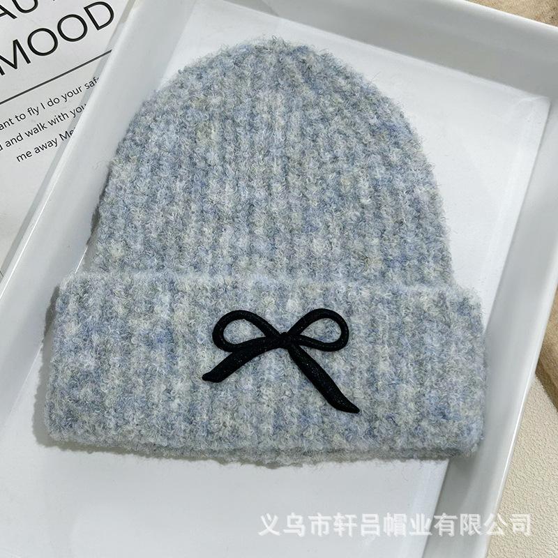 Versatile fashion embroidered bow knitted hat autumn and winter new solid color versatile warm wool hat cold hat