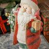 Santa Claus figure with tree and gift, 3 warm white LEDs, battery-operated, 50 cm