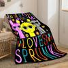 Three cartoon characters with colorful text and flowers on a black background. for all seasons blanket lunch break throw gift