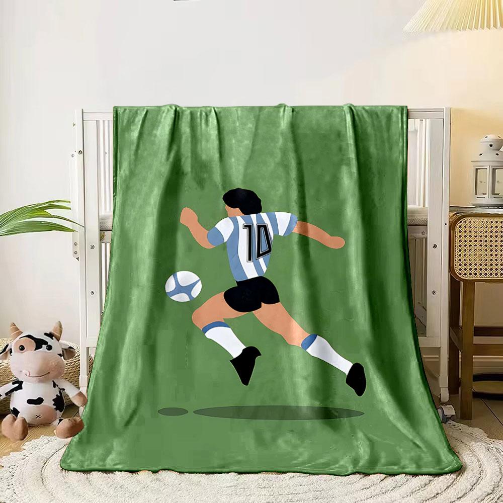 Illustration of a soccer player wearing stripes chasing a ball on a green field. for all seasons blanket lunch break throw gift