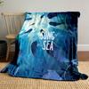 Silhouettes of seals swimming toward light underwater with a glowing effect. for all seasons blanket lunch break throw gift