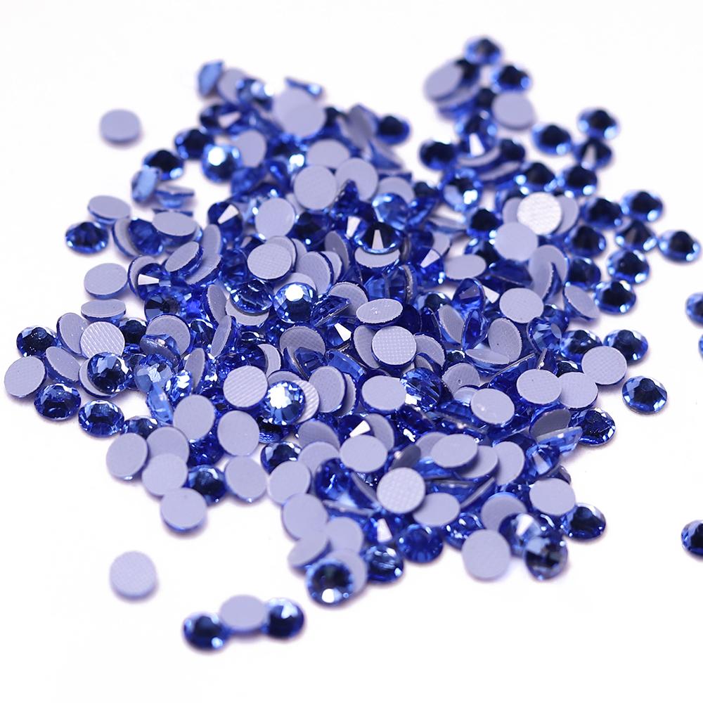 Zk High Quality Washable Light Sapphire SS6-SS30 Heat Fix Glass Crystal Eco-Friendly 12 Facets Loose Rhinestones