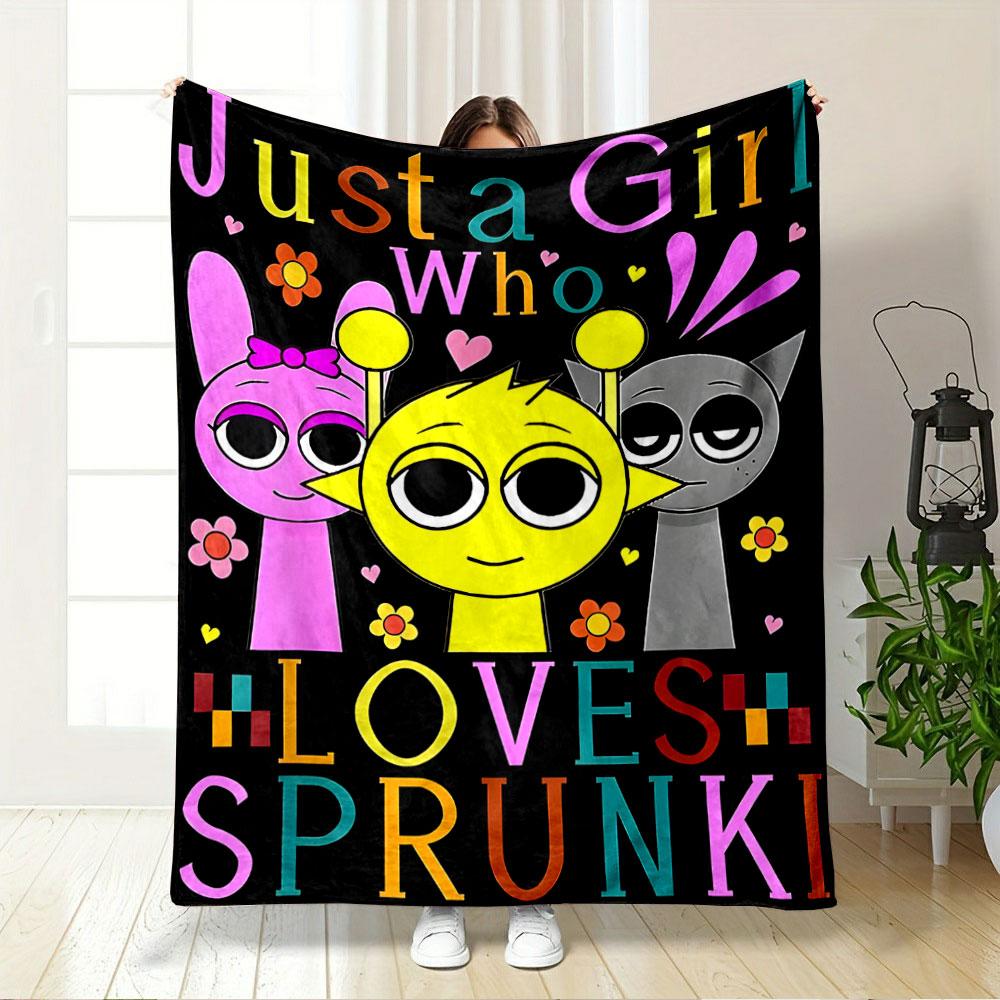 Three cartoon characters with colorful text and flowers on a black background. for all seasons blanket lunch break throw gift