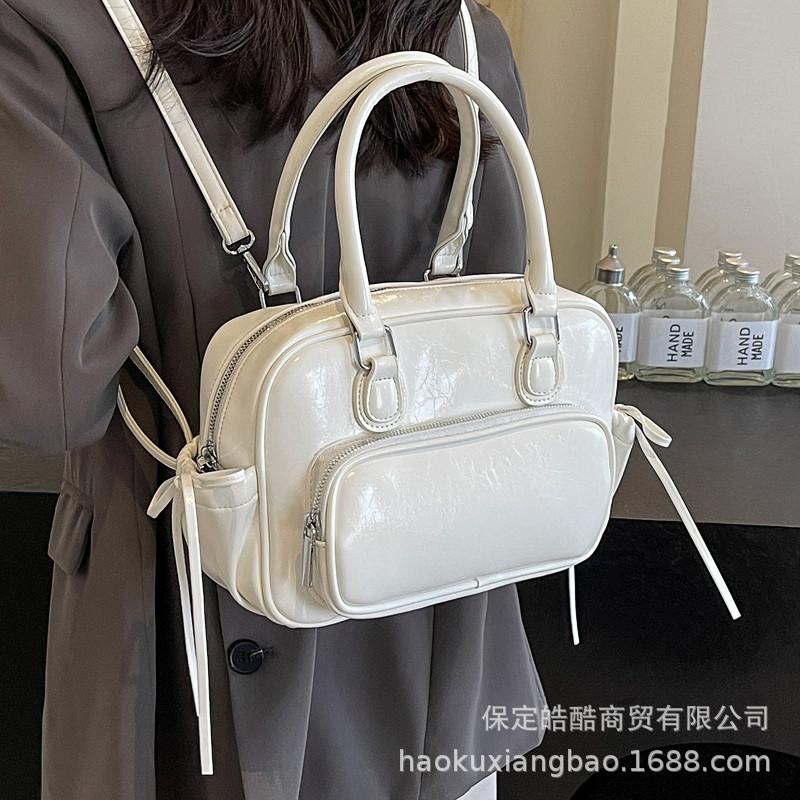 Рюкзак Женский рюкзак 2025 Новый Большая вместимость Нишевый Простой Городской Колледж Колледжный стиль Кожаная школьная сумка