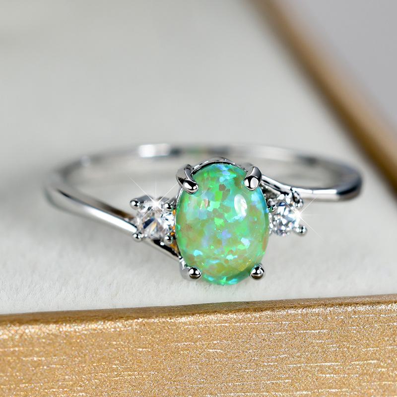 Shein explosion four-claw oval opal edge inlaid with white diamond zircon silver ring female, high-end simple and versatile
