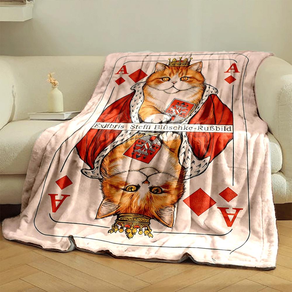 A crowned orange cat in royal attire mirrored on a playing card design. for all seasons blanket lunch break throw gift