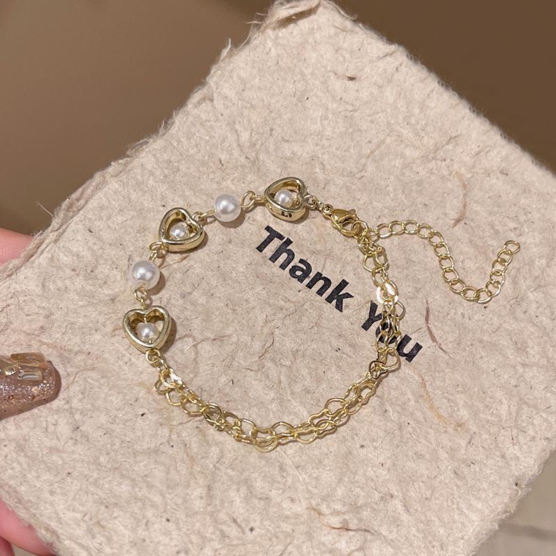 Корейский браслет с полым сердечком из жемчуга — элегантные украшения в холодном стиле для женщин