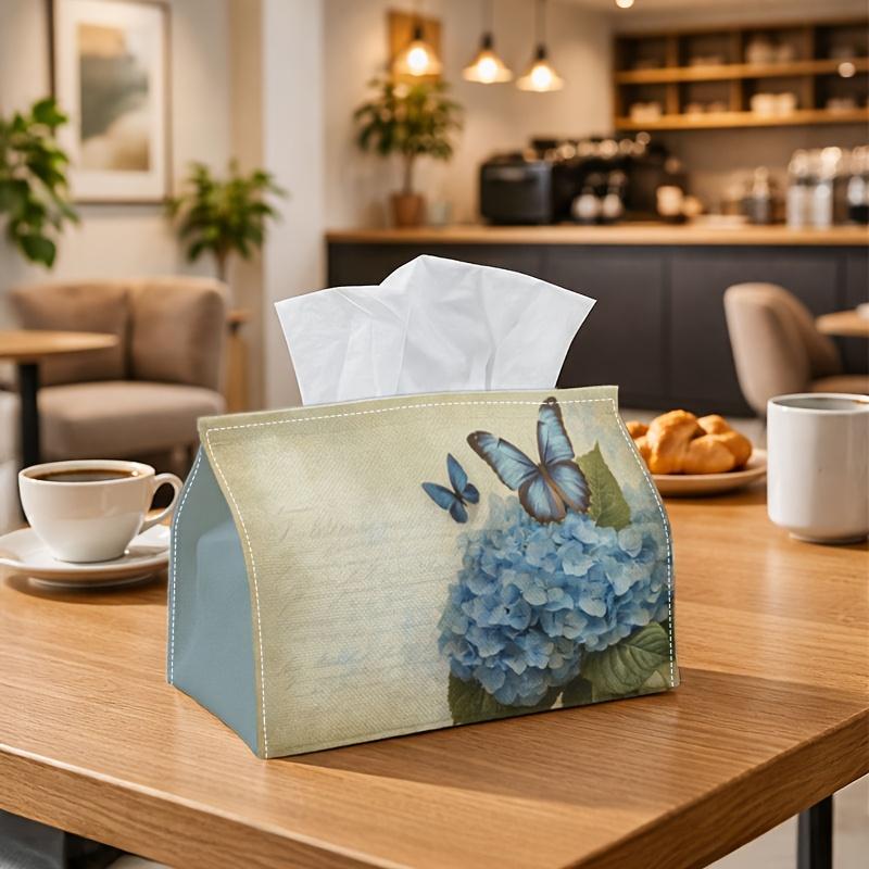A Vintage-Style Tissue Box Featuring a Blue Hydrangea And Butterfly Design, Perfect for Storing Napkins in a Shabby Chic Manner. This Elegant Organize