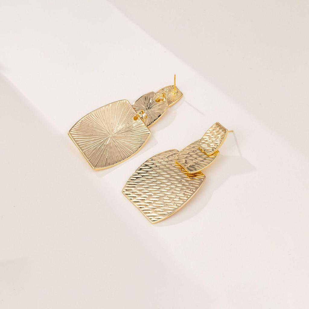 "Modern European & American Gold-Plated Statement Earrings - High-End Niche Design"