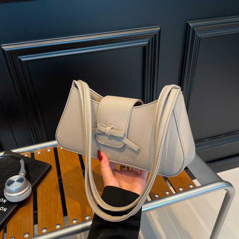 Повседневная нишевая дизайнерская сумка-подмышка женская новая модная темпераментная通勤 текстурная персонализированная сумка-полумесяц