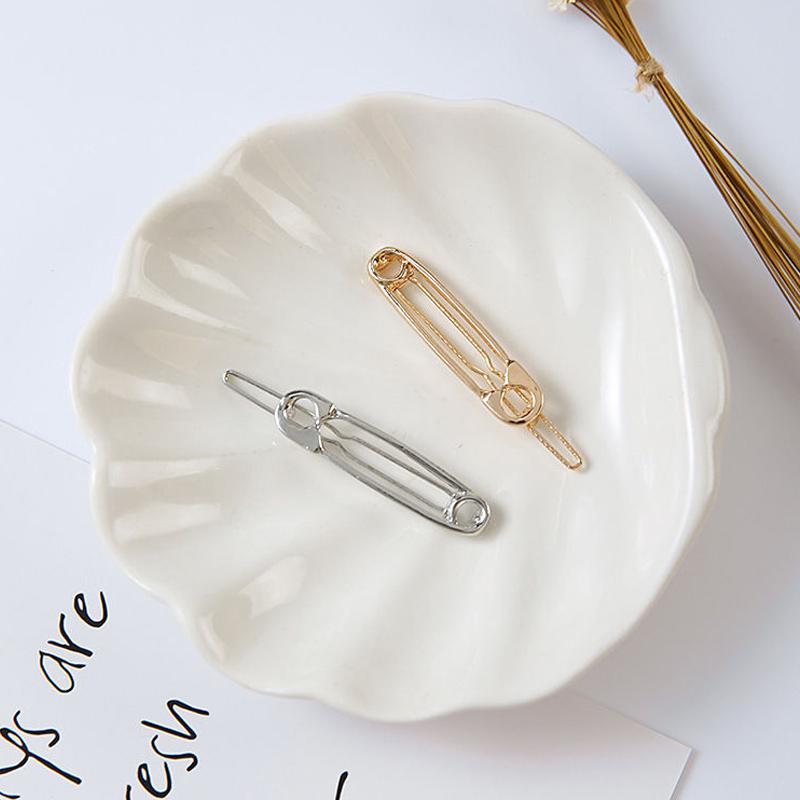 Модный аксессуар для волос. Заколка в виде булавки. Отлично держит волосы и привлекает внимание окружающих свой оригинальностью