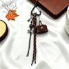 Кожаный кошелек-брелок с леопардовым принтом и подвеской в виде милой плачущей куклы