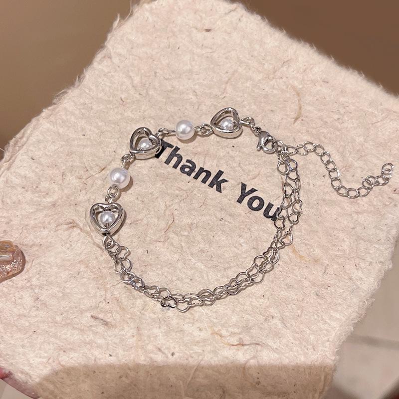 Корейский браслет с полым сердечком из жемчуга — элегантные украшения в холодном стиле для женщин