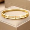 Luxurious hollow lace floral design inlaid with synthetic zirconium, copper open bangle with delicate beaded edges and carved patterns, a delicate
