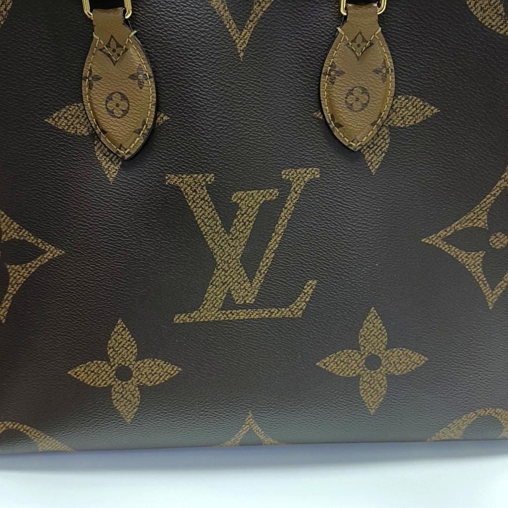 [Pre-Owned] Louis Vuitton Onthego MM 'Brown Giant Monogram/Brown Monogram Reverse Canvas' - Fair #1JJY6YW