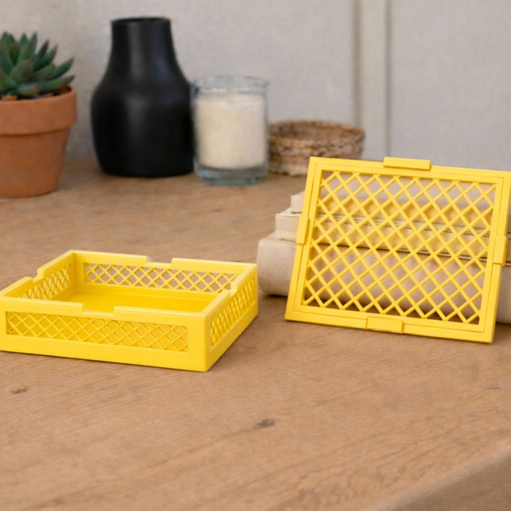 Container with a lid, yellow openwork organizer for small items for the home