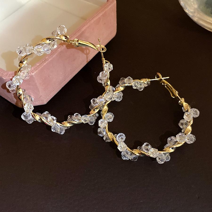 Silver needle pearl beaded twisted round earrings simple fashion earrings light luxury high sense earrings design sense niche