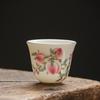 Dehua Suet Jade White Porcelain Teacup with Nine Peaches Design